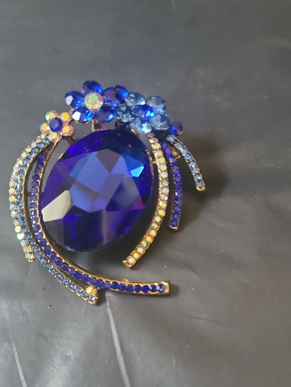 Blue Brooch With Flower Accents